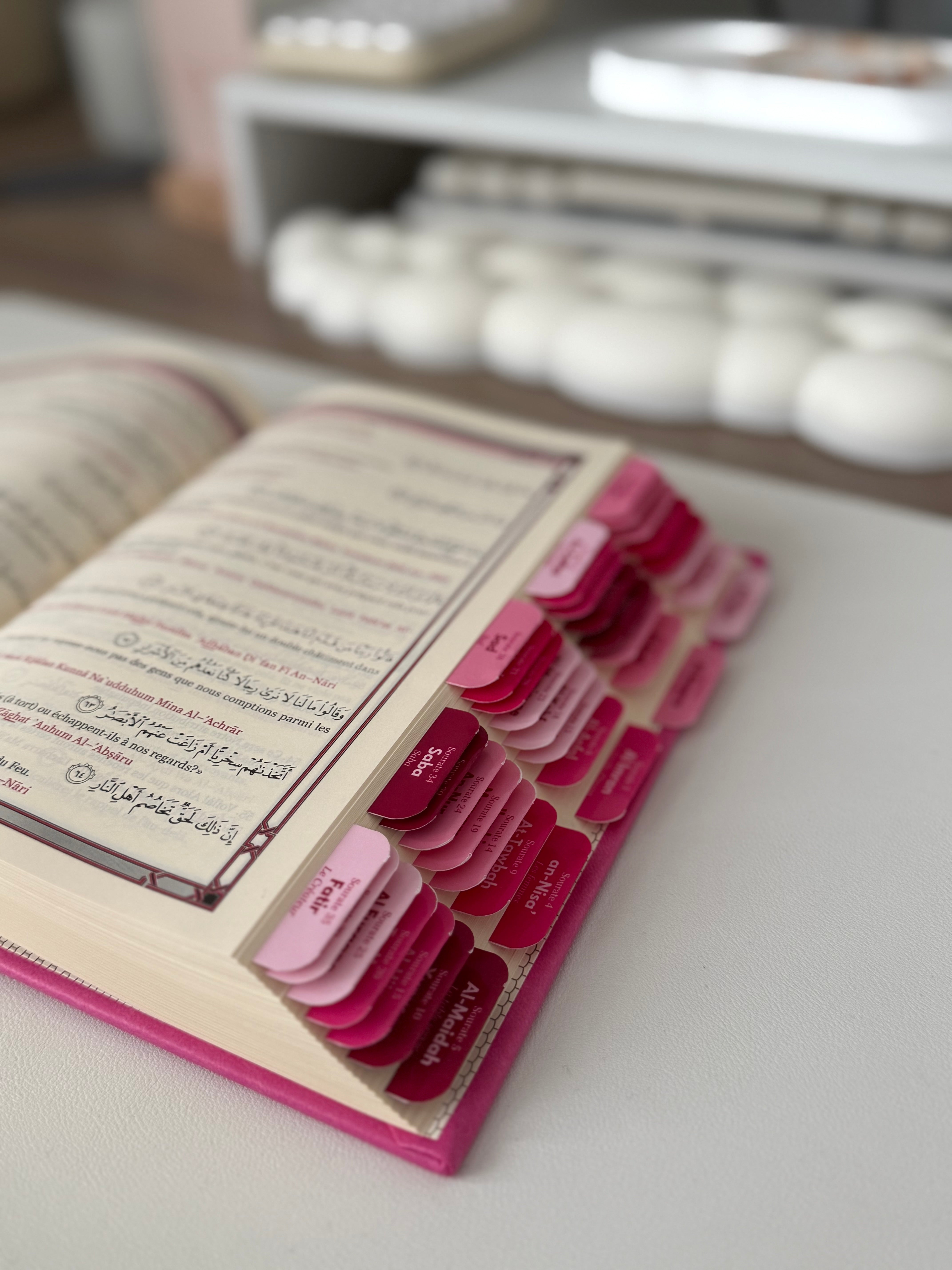 Quran with raspberry tabs